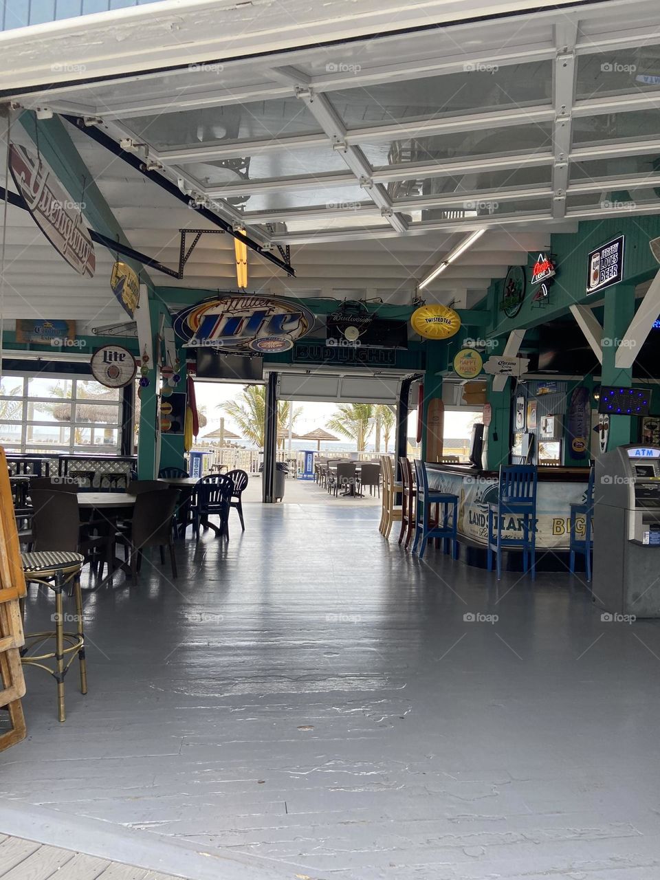 A view of the inside of Jenks Inlet Bar & Grill, a favorite local spot, located on the North end of the Point Pleasant Beach boardwalk in NJ near the Manasquan inlet. Here you can sit inside or outside and enjoy amazing views of the beach and ocean.