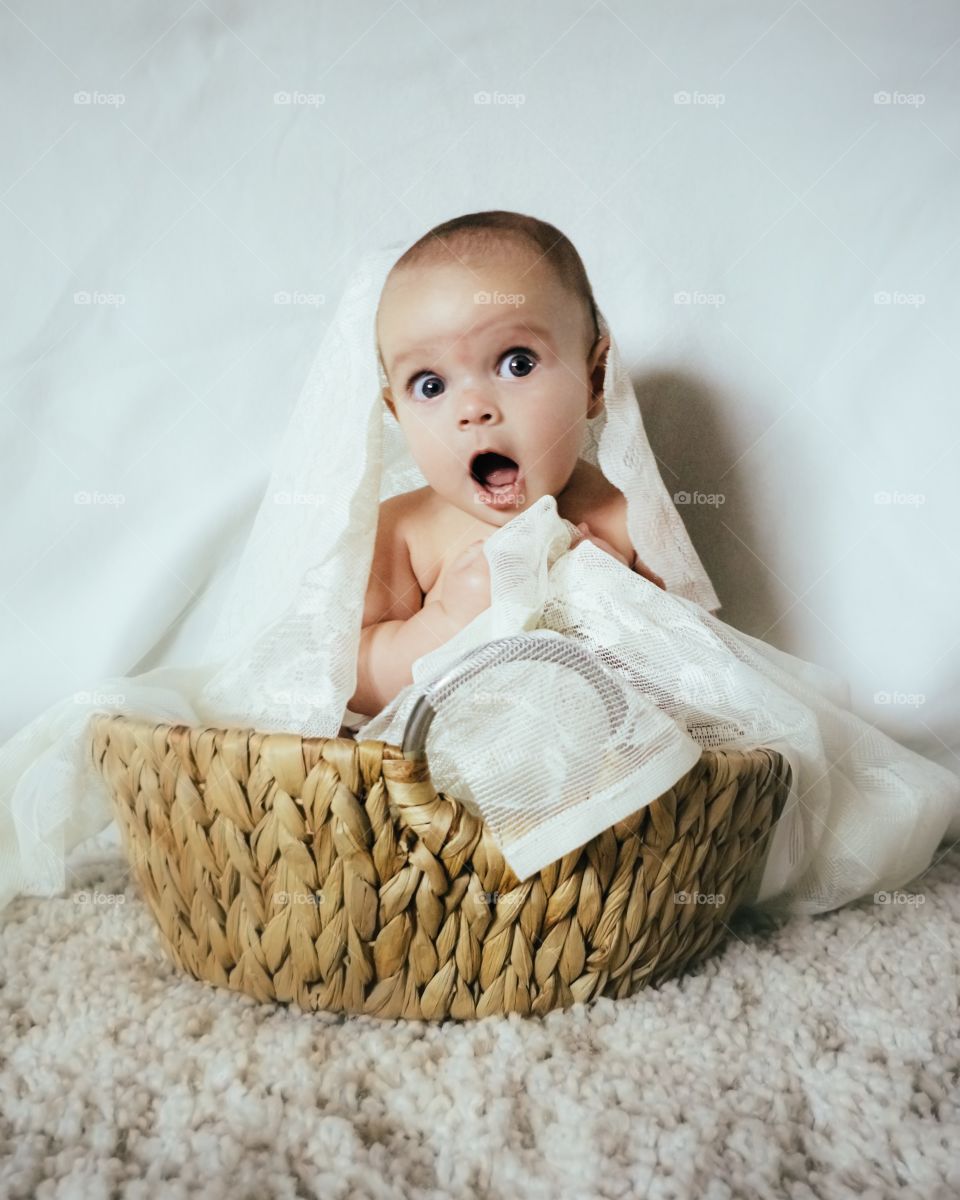Portrait of baby with basket