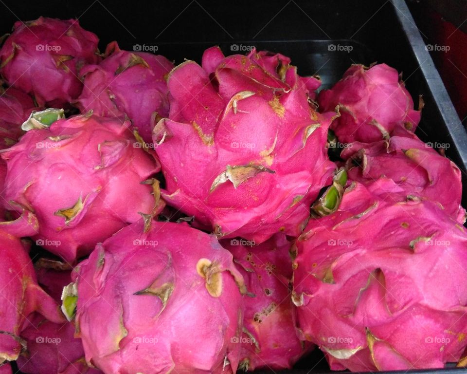 Fresh dragon fruits on market