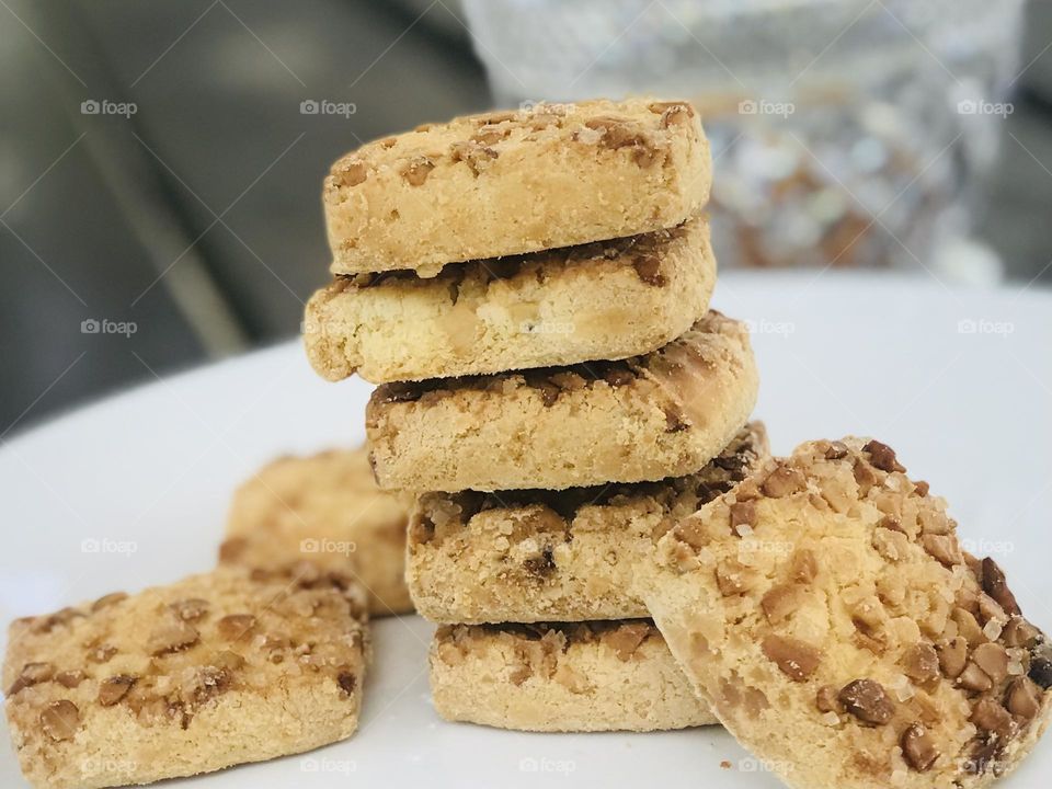 Dry fruits coated Indian cookies on a plate 