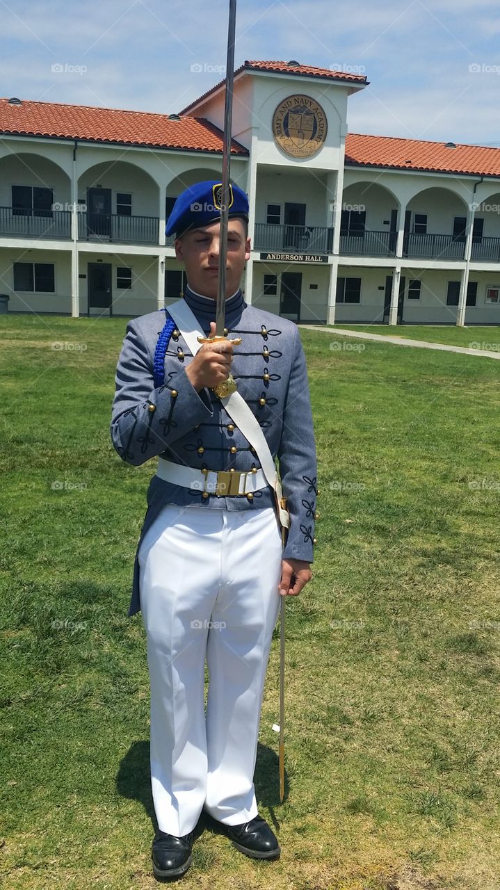 Military Cadet Gives Salute