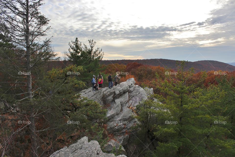 people on the rock