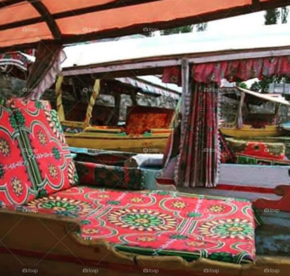 Comfy interior of shikara at Dal Lake, Srinagar