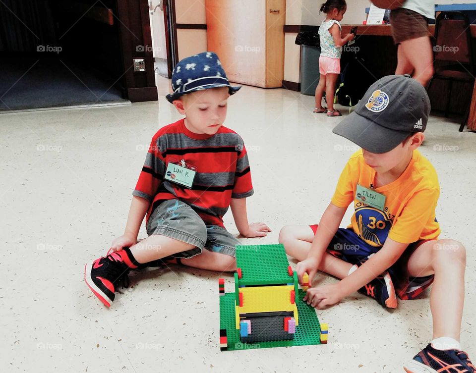 Boys building with Legos