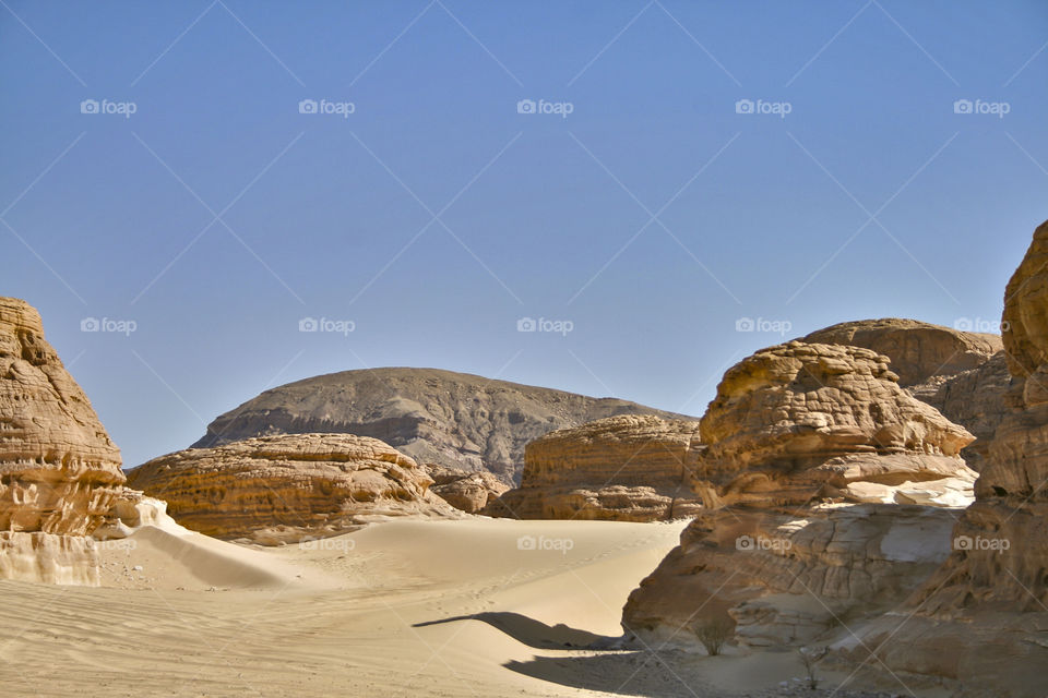 The valleys of the Sinai desert are surrounded by mountains and boulders