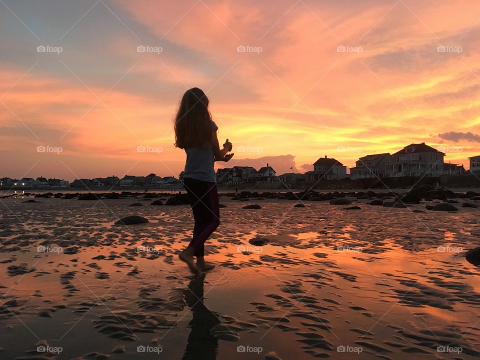 Ocean play at sunset Wells, Maine 