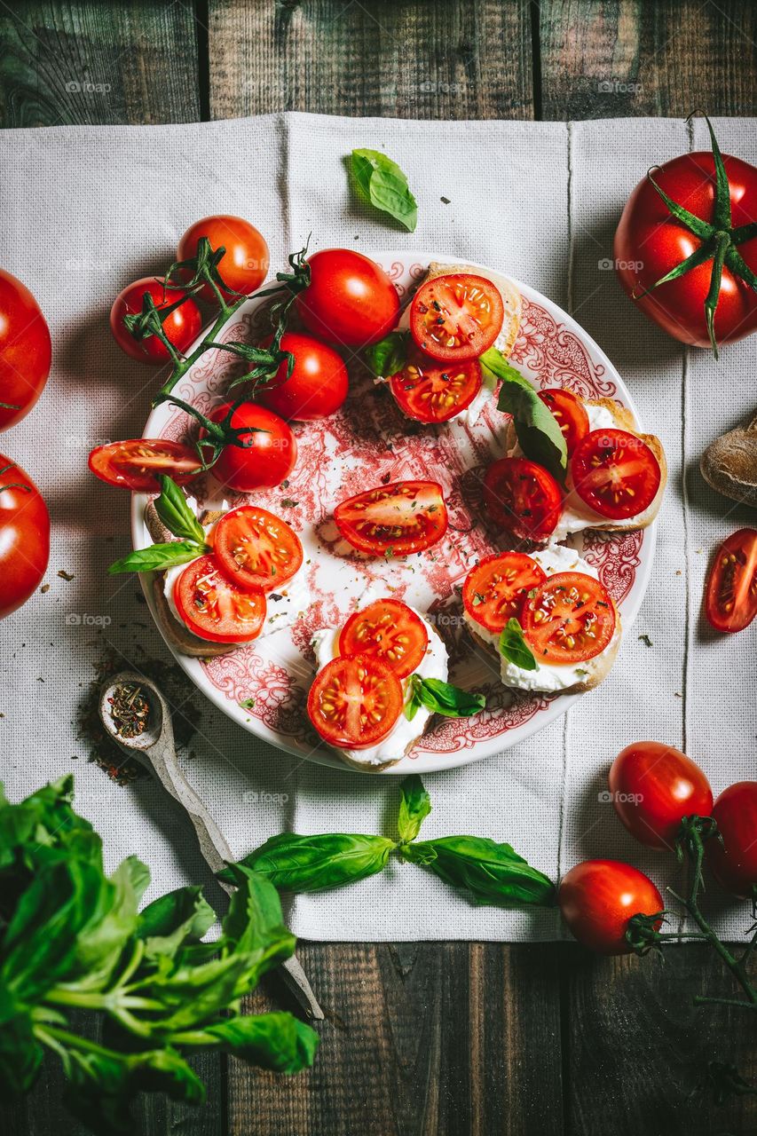 Fresh tomatoes with cheese on canape