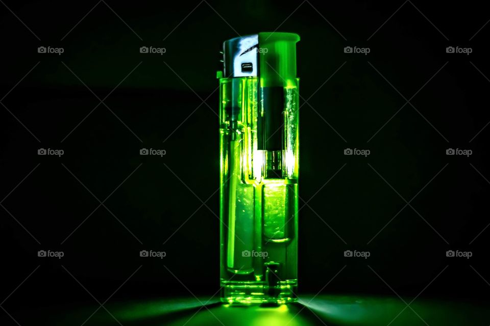 Green lighter with green reflection