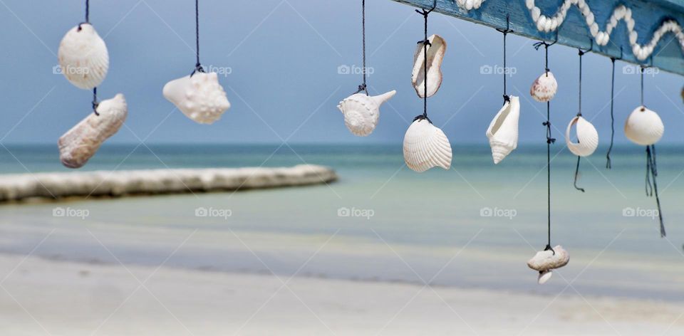 She sells seashells by the seashore. Calm and peaceful Holbox Island.