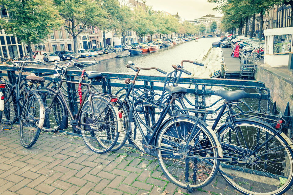 Amsterdam canal and bikes. View of a canal in Amsterdam, The Netherlands