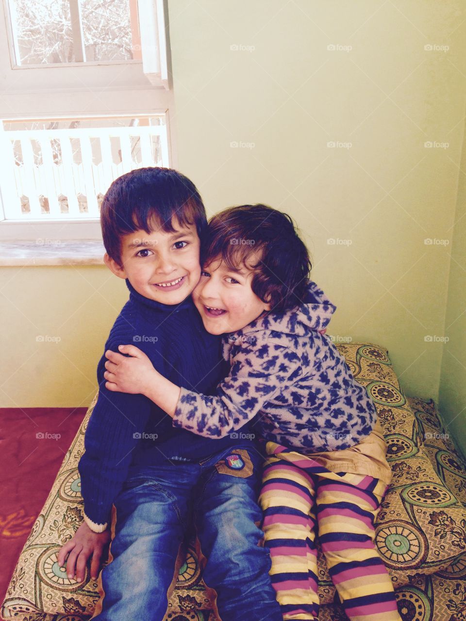 Portrait of happy brother and sister