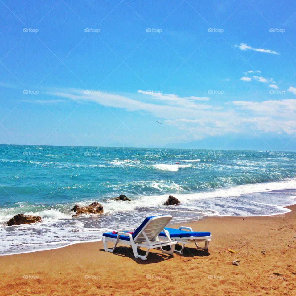 Empty launge chair at beach