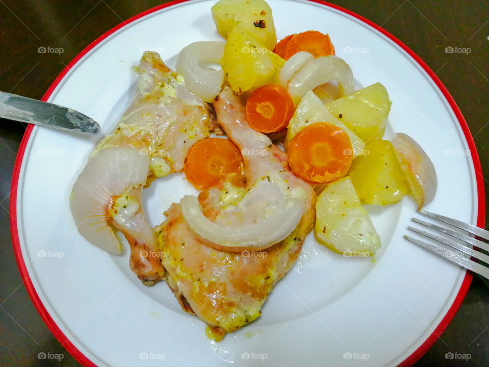 Chiken legs in mayonnaise and with vegetables baked in oven