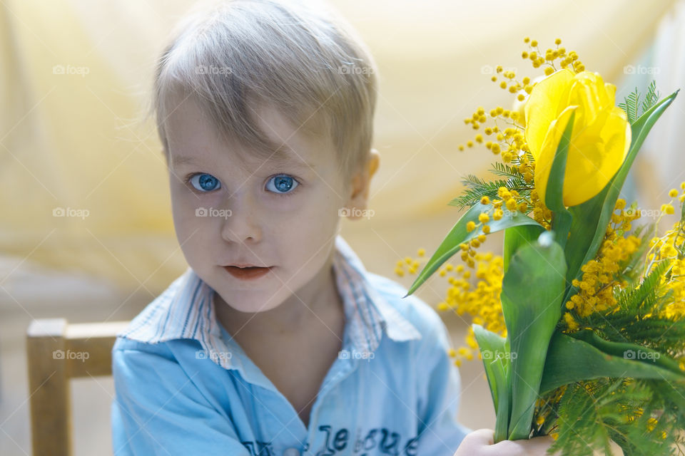 Boy with flowers