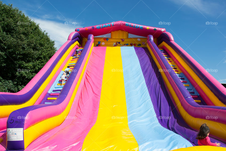 Slide and bouncy castle at a funfair in Malmö Sweden.