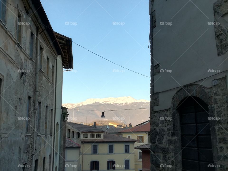 The old part of Rieti town. The Terminillo Mountain in the distance