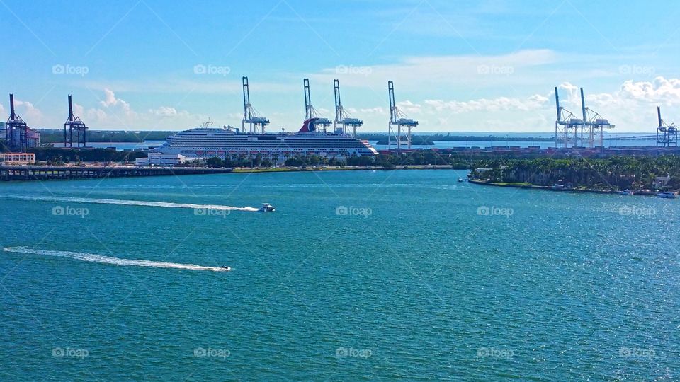 This was so cool.. these jet skiers race up and down this waterway while the cruise ships head out to sea...