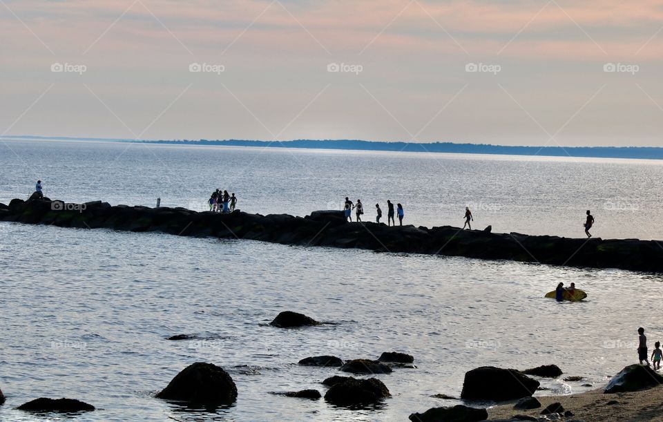 People enjoying the beach on a hot June day