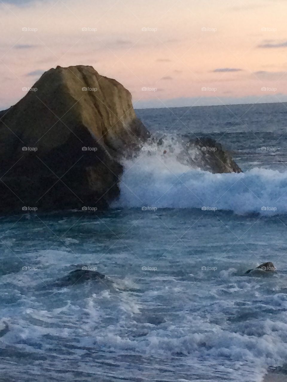 Waves crashing the rock