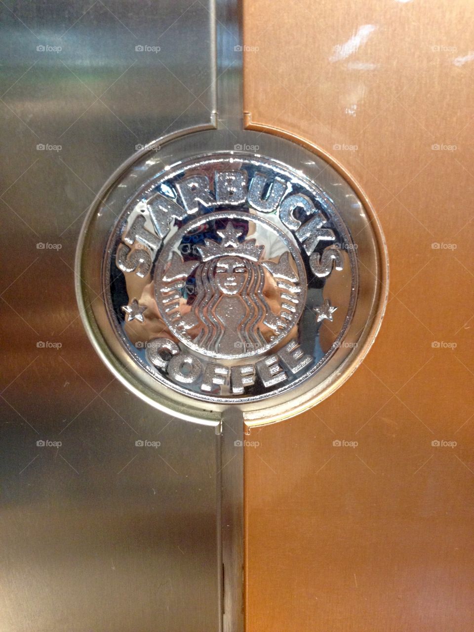 Starbucks sign on a coffee machine close up