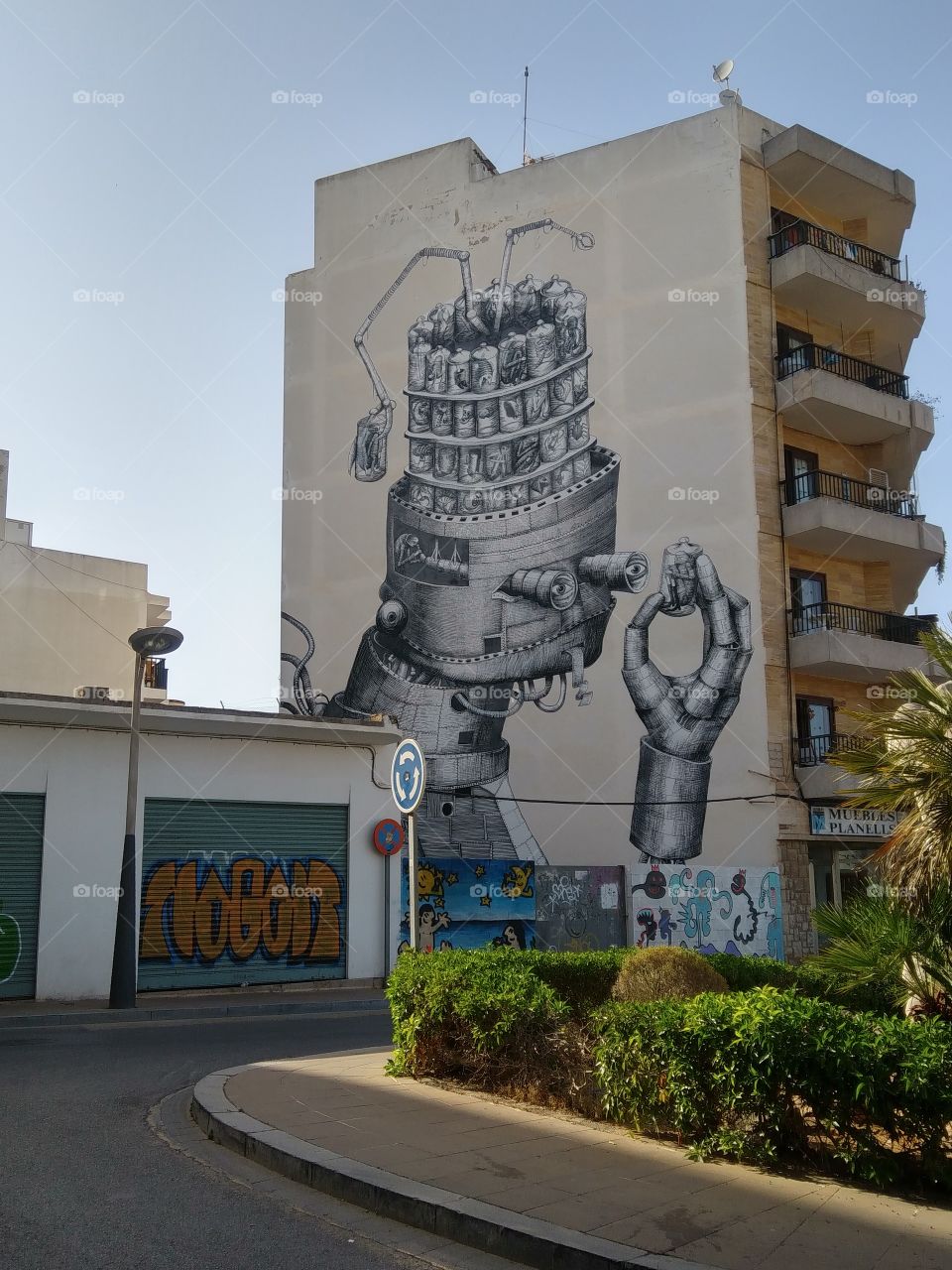 A stunning robot graffiti on the wall of a building in Ibiza.