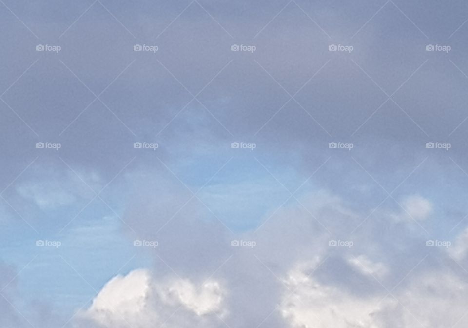 Photo of the sky with different types of clouds. Use your fantasies from high in the sky.