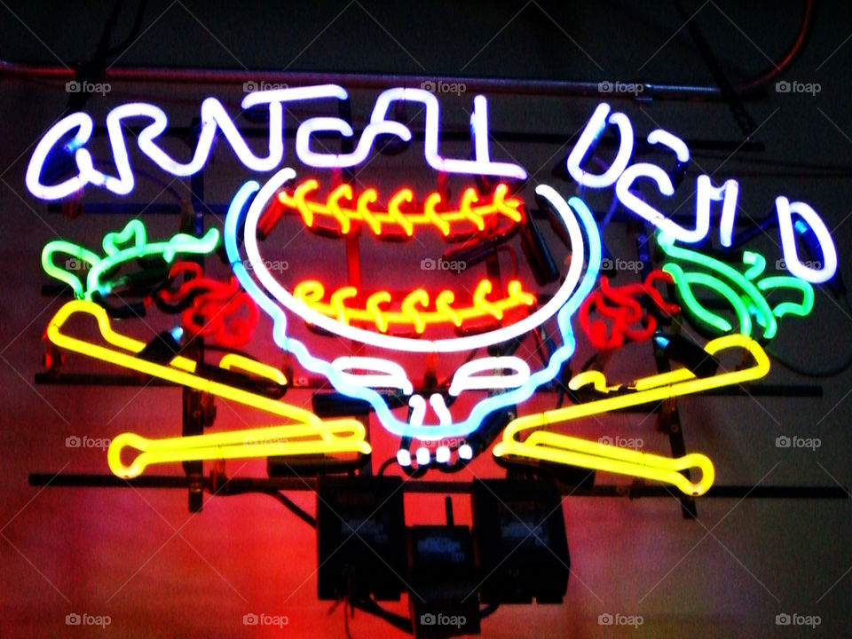 Neon Grategul Dead sign in a bar. 