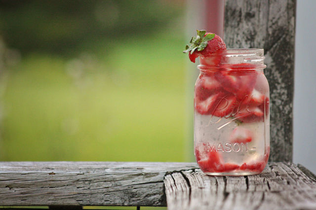 Fresh Strawberries in glass of water