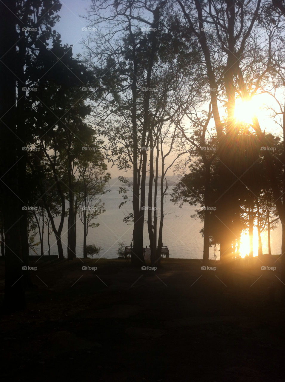 Sunset at a reservoir in Kanchanaburi, Thailand.