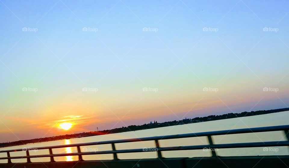 Sunset driving over the Neuse River Bridge in New Bern, NC.