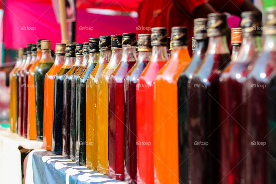 Close-up of multi colored bottles