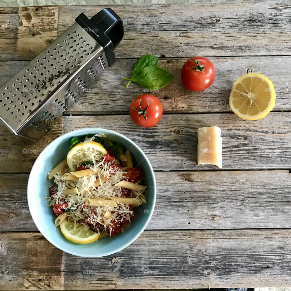 High angle view of pasta with cheese grater