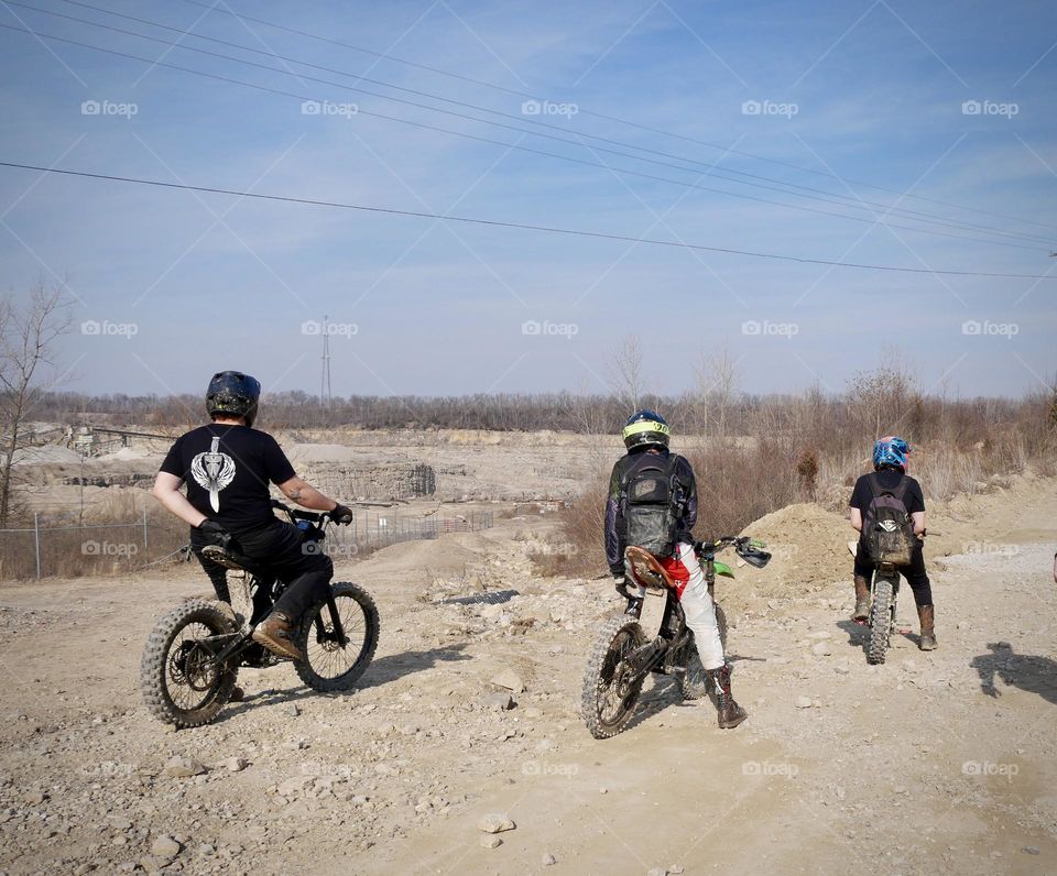 Youngsters on dirt bikes, enjoying a warm Saturday at the park. 