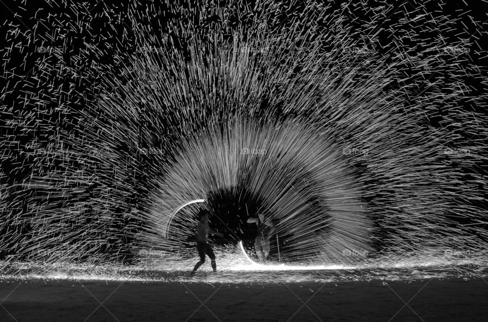 firework fire show talent on the beach in black and white landscape koh chang island thailand