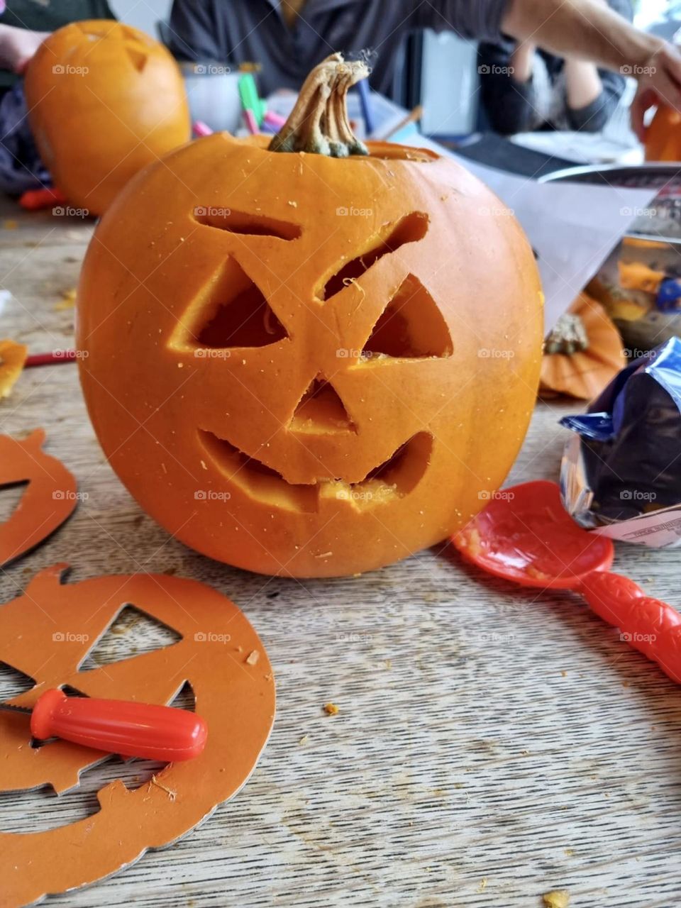 Carved Halloween pumpkin with carve tools