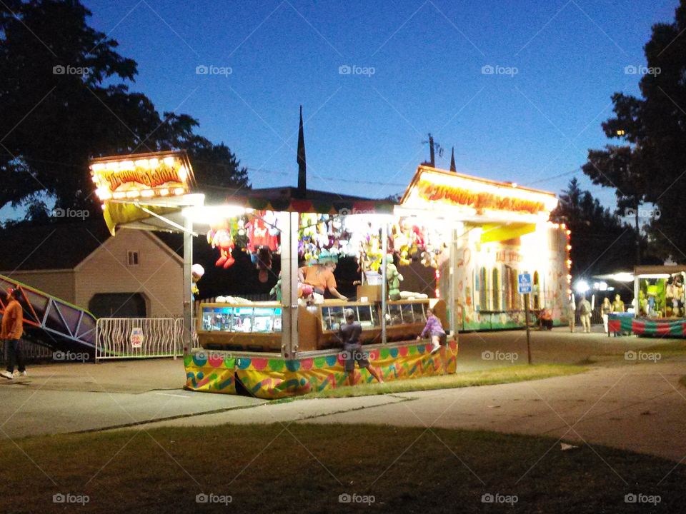 Summer Fair. Game booth lit up at a summer carnival