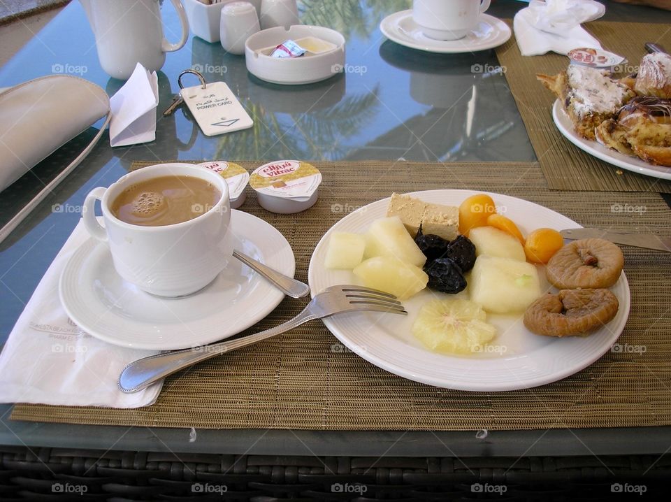Fruits with coffee on a table