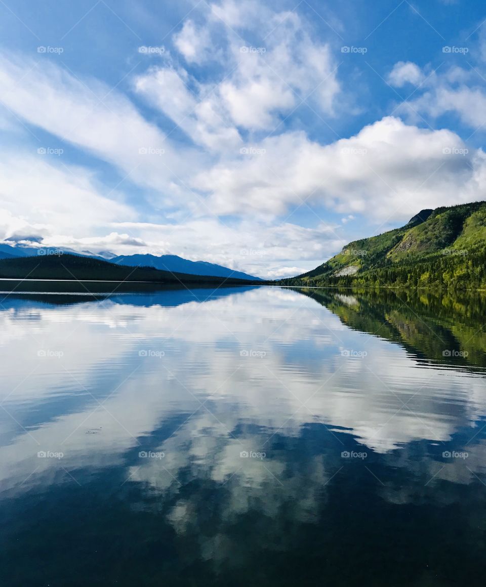 Reflection of a beautiful fall day on Pickhandle Lake, Yukon Canada