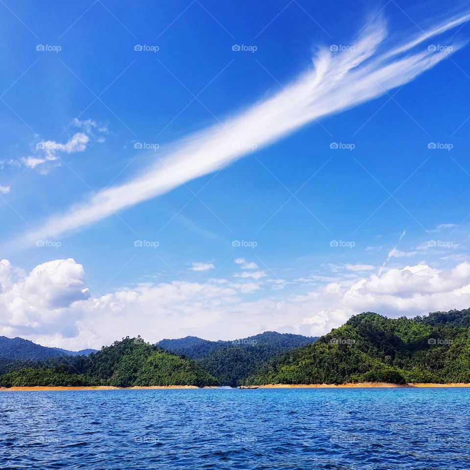 Scenic view of lake against blue sky