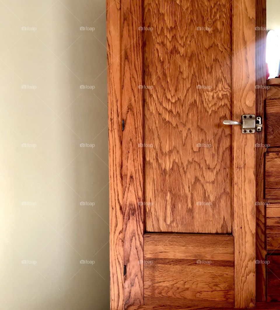 Closeup of wooden wardrobe with morning sunlight 