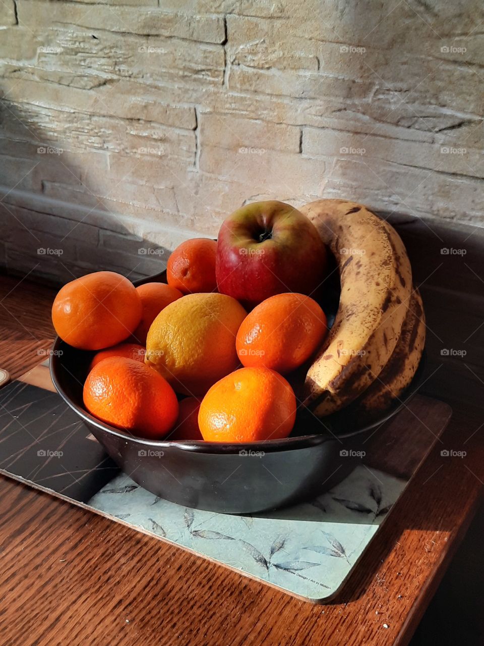 healthy snack  - bowl of fruits  in the sunshine