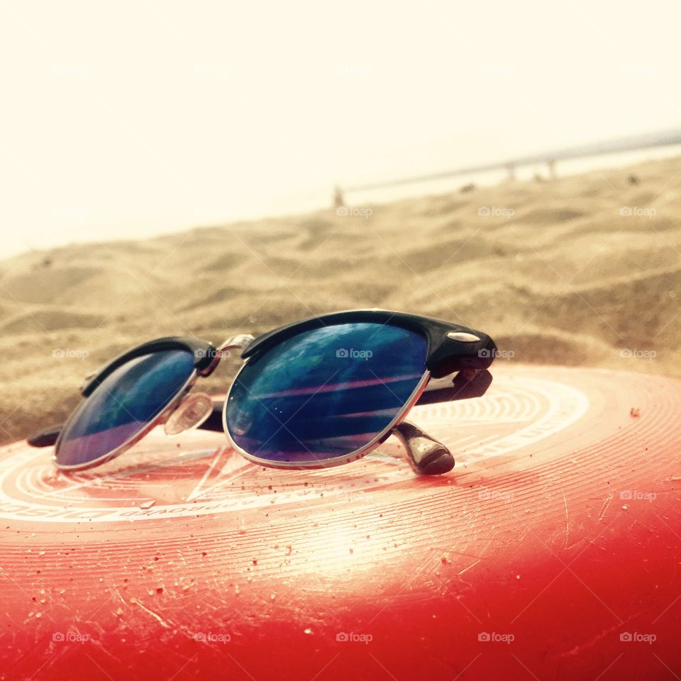 Summer. On a beach during summer. Warm sand, bright sun, good friends, good vibes.