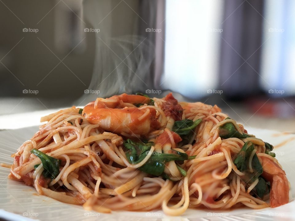 Homemade Capellini Linguini Pasta with Shrimp, Spinach, Roasted Peppers on a Homemade Marinara Sauce .
