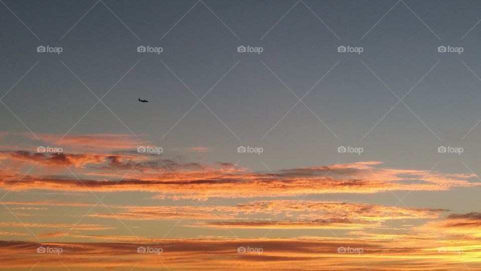 Distant view of airplane flying in sky