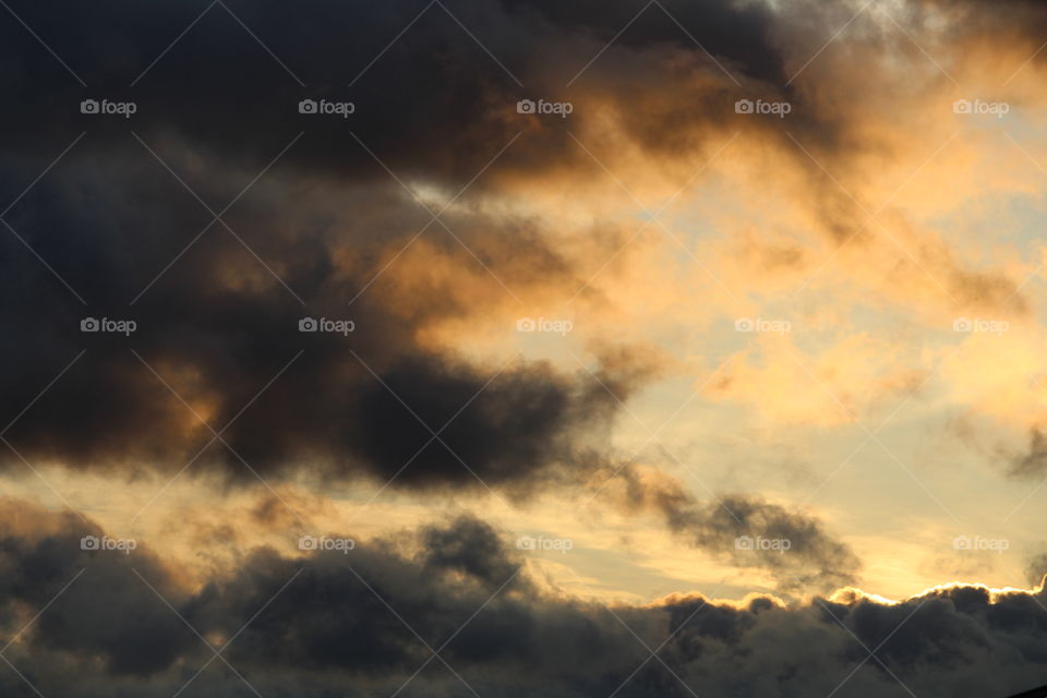 Sunrising on a very dark cloudy morning