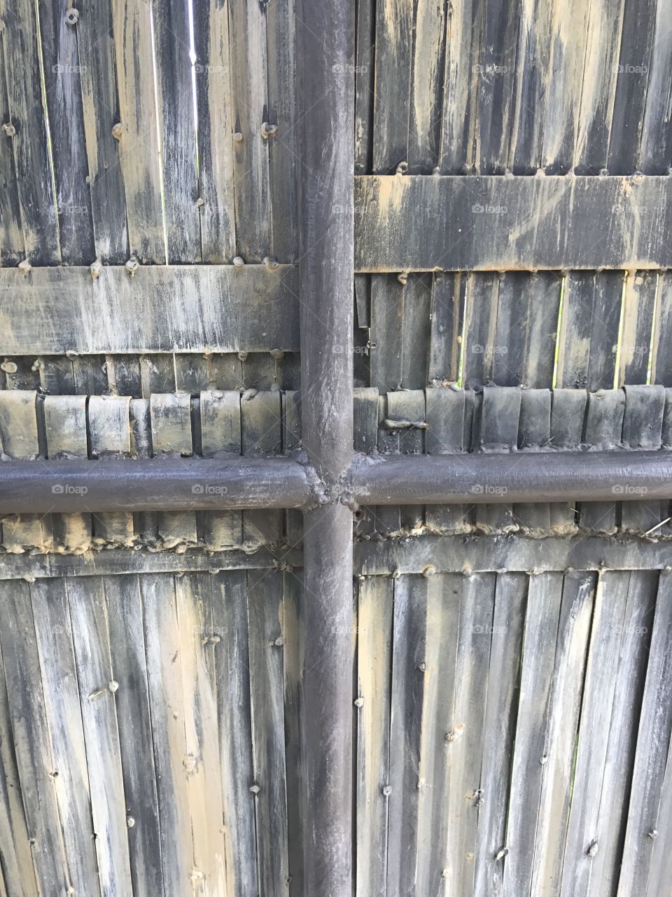 Iron Rods Supporting wooden wall