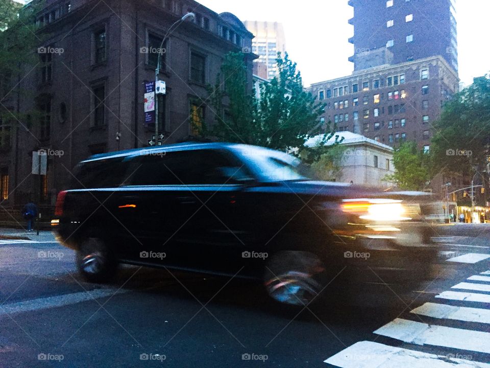 Car speeding down street in Manhattan 