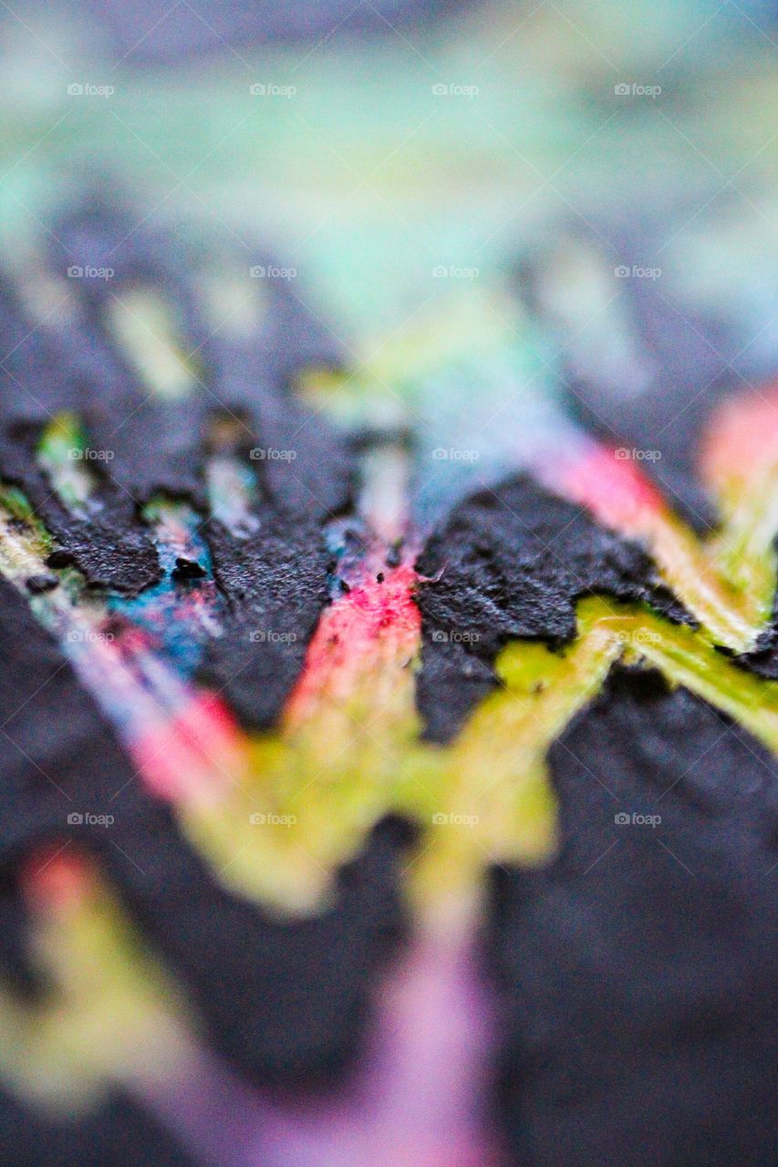 Macro photo of a scratch board up close  with only small details in focus.