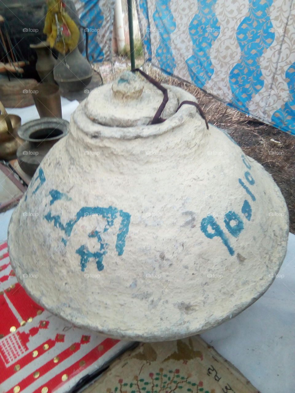 a handmade pitcher made of cardboard and other things.