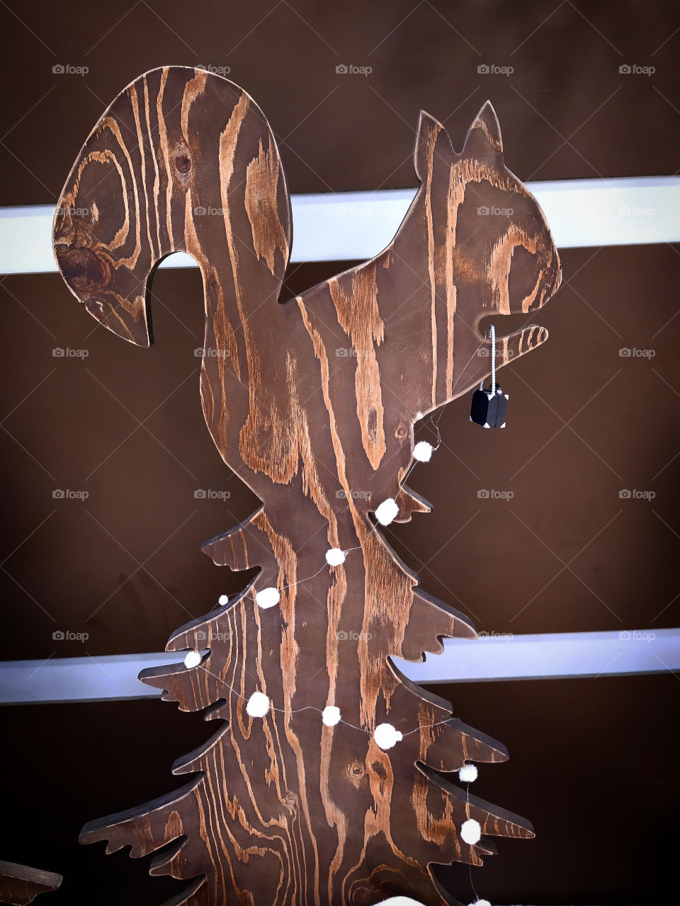 Scenery.  Wooden squirrel on a wooden Christmas tree